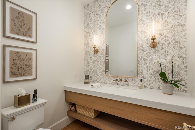 bathroom with vanity and toilet