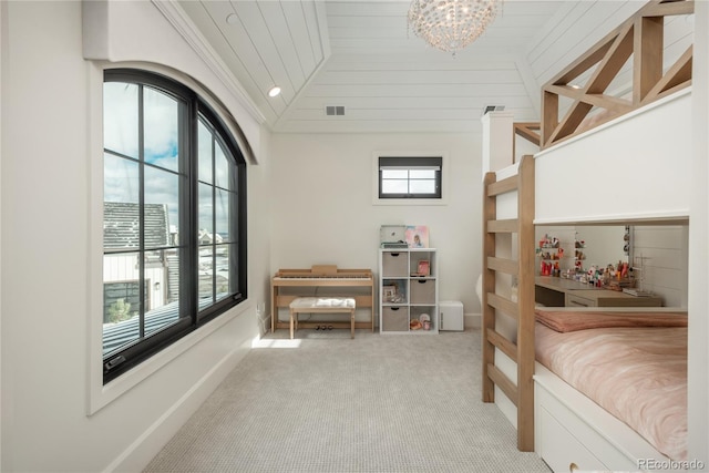 bedroom with multiple windows and wood ceiling