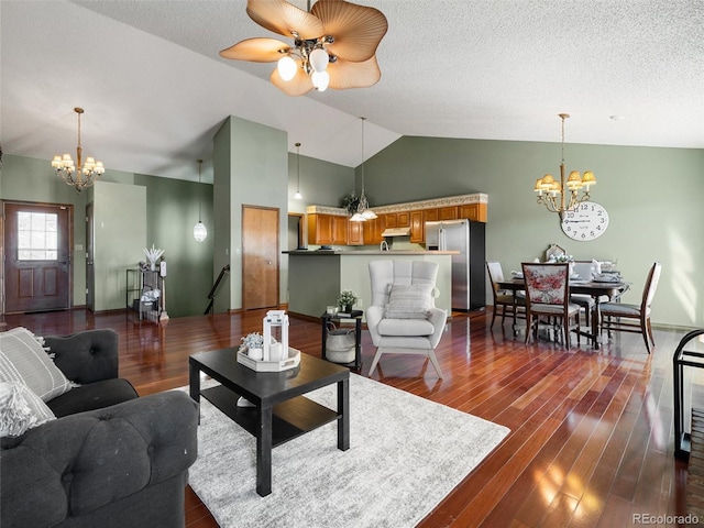 living room featuring high vaulted ceiling, dark wood finished floors, a textured ceiling, and ceiling fan with notable chandelier