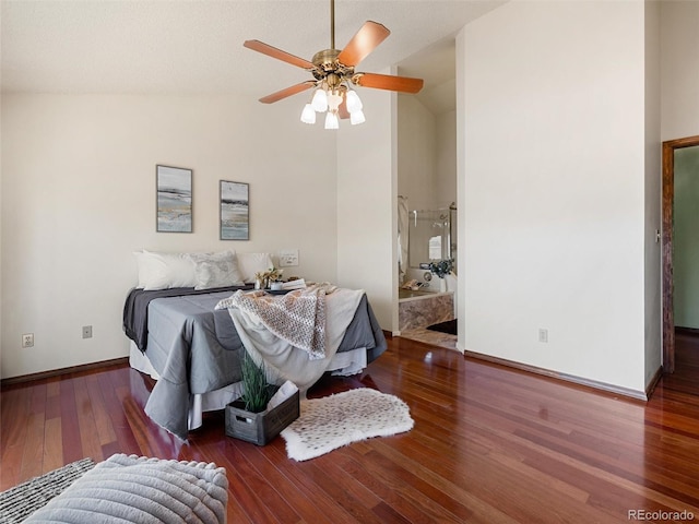 bedroom featuring lofted ceiling, ceiling fan, wood finished floors, and baseboards