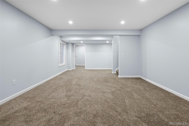 below grade area featuring carpet floors, recessed lighting, and baseboards