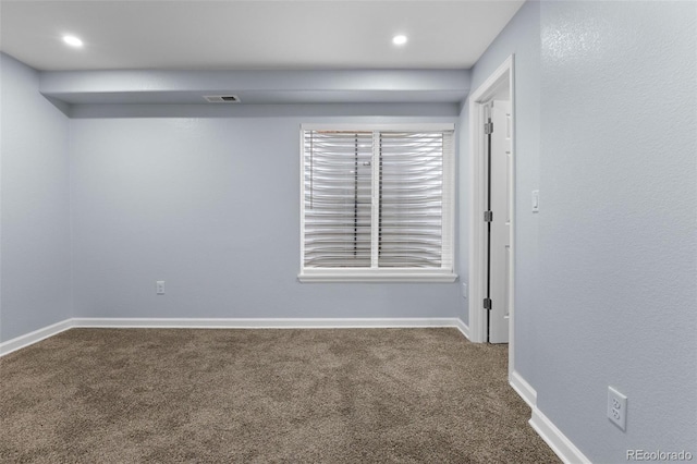 carpeted empty room with recessed lighting, visible vents, and baseboards