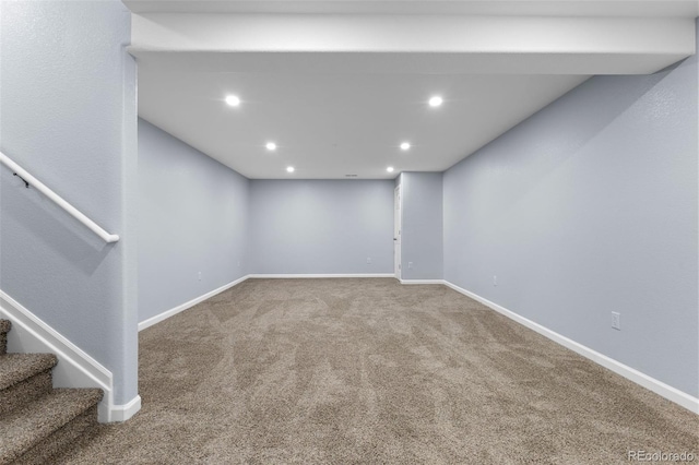 finished below grade area featuring stairs, baseboards, carpet flooring, and recessed lighting