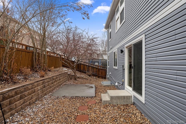 view of yard featuring a patio area and a fenced backyard