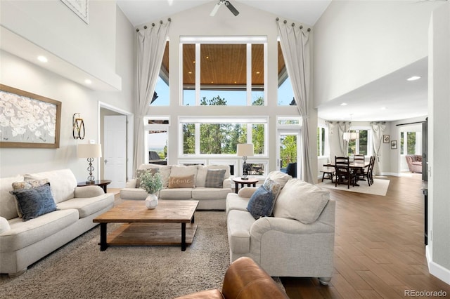 10914 Remmick Ridge Rd, Parker, CO 80134 - living area featuring high vaulted ceiling, wood finished floors, a ceiling fan, recessed lighting, and baseboards