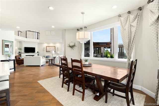 10914 Remmick Ridge Rd, Parker, CO 80134 - dining area with recessed lighting, wood finished floors, and baseboards