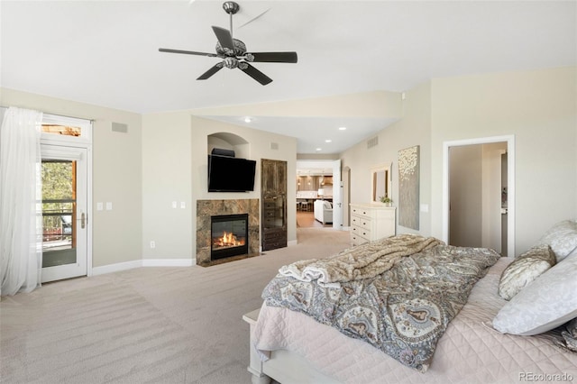 10914 Remmick Ridge Rd, Parker, CO 80134 - bedroom with light colored carpet, a fireplace, baseboards, and ceiling fan