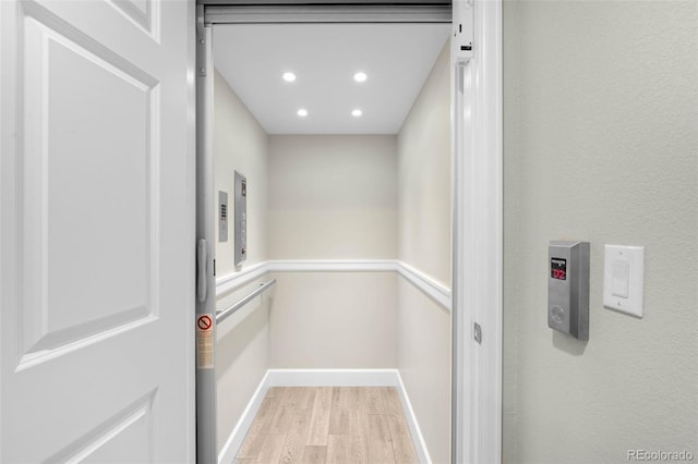 10914 Remmick Ridge Rd, Parker, CO 80134 - elevator with wood finished floors, recessed lighting, and baseboards