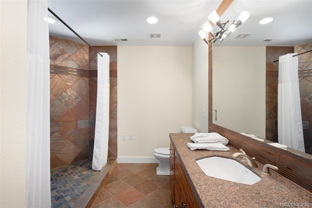 10914 Remmick Ridge Rd, Parker, CO 80134 - bathroom with vanity, toilet, tiled shower, and recessed lighting