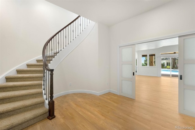 10914 Remmick Ridge Rd, Parker, CO 80134 - staircase with wood finished floors and baseboards