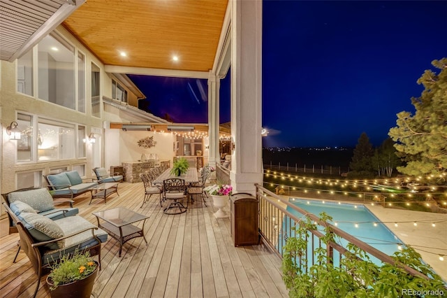 10914 Remmick Ridge Rd, Parker, CO 80134 - deck at twilight featuring an outdoor hangout area