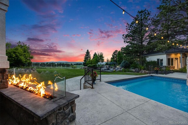 10914 Remmick Ridge Rd, Parker, CO 80134 - outdoor pool featuring a patio and a yard
