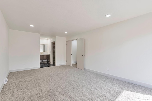 12164 E Amherst Cir, Aurora, CO 80014 - unfurnished living room featuring carpet flooring, baseboards, and recessed lighting