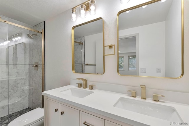 12164 E Amherst Cir, Aurora, CO 80014 - full bath with a sink, double vanity, toilet, and a shower stall