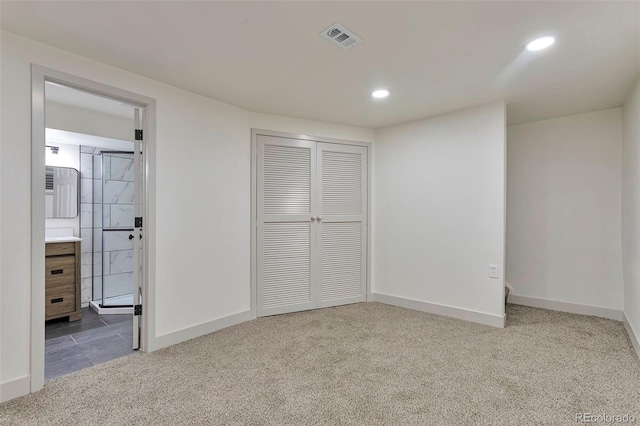 12164 E Amherst Cir, Aurora, CO 80014 - unfurnished bedroom with baseboards, carpet flooring, a closet, and visible vents
