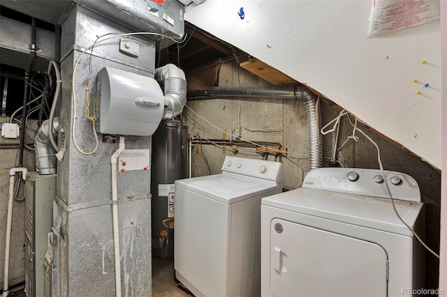 12164 E Amherst Cir, Aurora, CO 80014 - clothes washing area with laundry area, water heater, and washer and clothes dryer