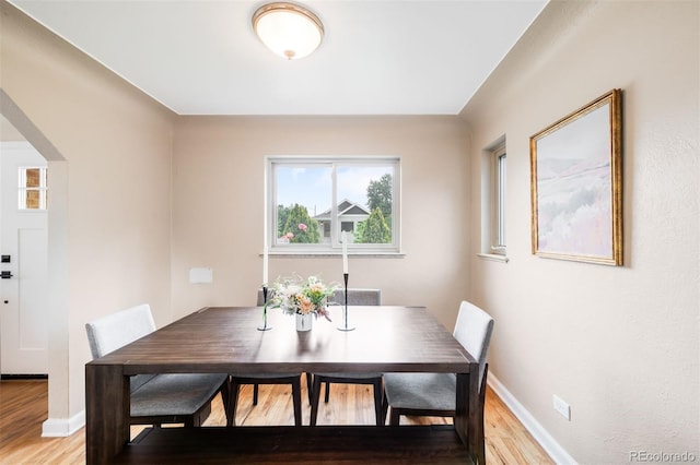 2255 Perry St, Denver, CO 80212 - dining area with light wood-style flooring and baseboards