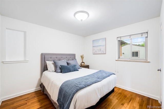 2255 Perry St, Denver, CO 80212 - bedroom with baseboards and wood finished floors