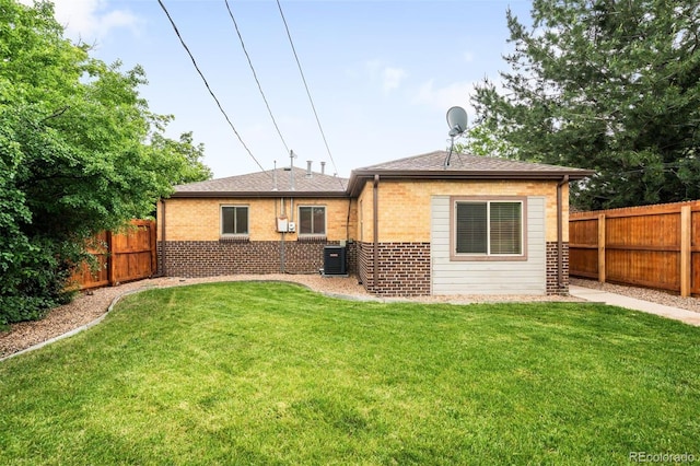2255 Perry St, Denver, CO 80212 - back of house with brick siding, central AC, and a shingled roof