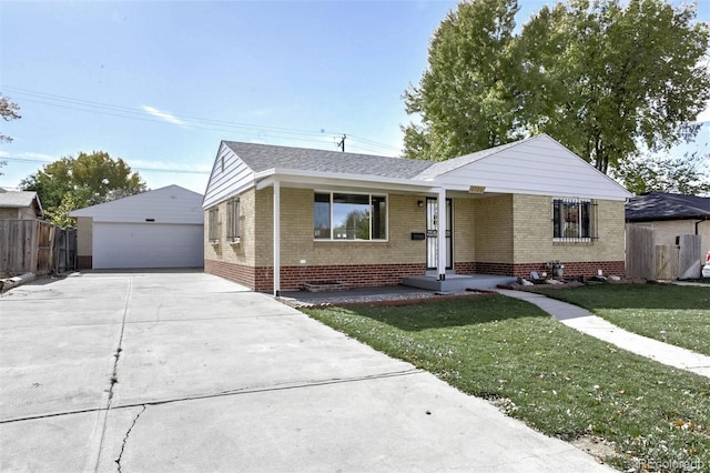 ranch-style house with an outbuilding, a garage, and a front yard