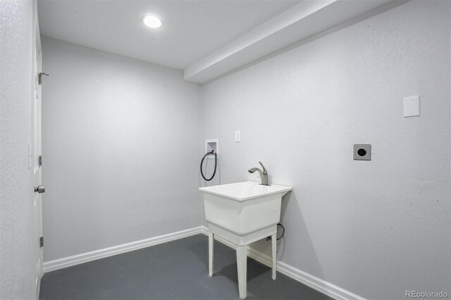 clothes washing area featuring laundry area, washer hookup, electric dryer hookup, and baseboards