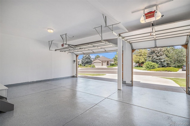 17174 E Rosebay Cir, Parker, CO 80134 - garage featuring a garage door opener and baseboards