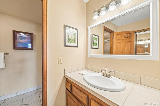 bathroom featuring vanity and tile patterned flooring