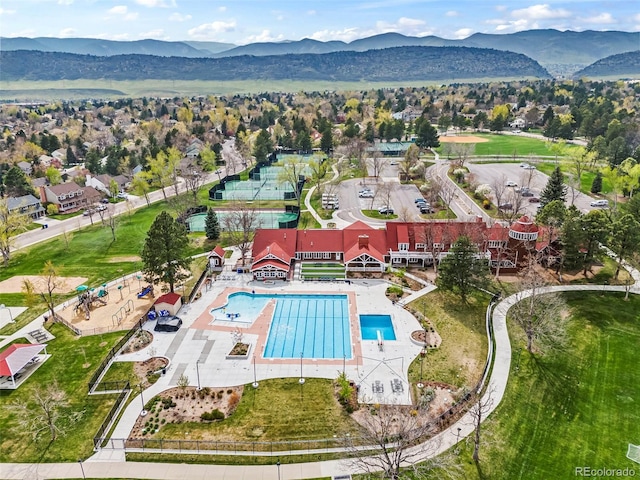 birds eye view of property featuring a mountain view