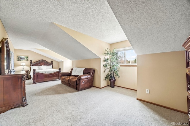 bedroom featuring a textured ceiling, light colored carpet, baseboards, and vaulted ceiling