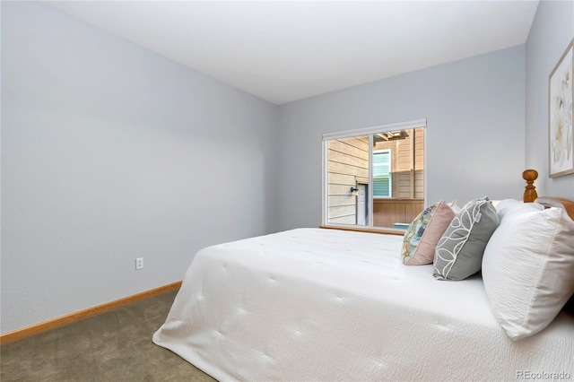 carpeted bedroom featuring baseboards