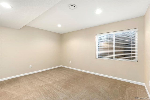 unfurnished room with carpet flooring, recessed lighting, and baseboards