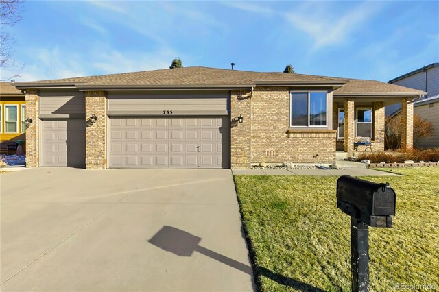 single story home featuring driveway, brick siding, and an attached garage