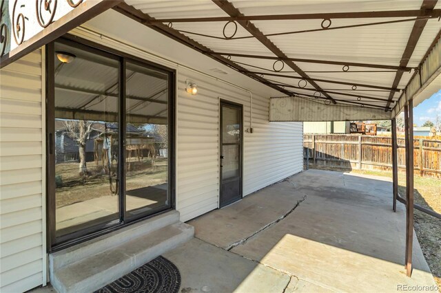 view of patio / terrace featuring fence