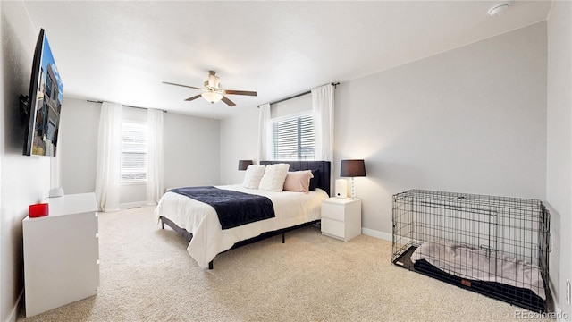 bedroom with carpet, ceiling fan, and baseboards
