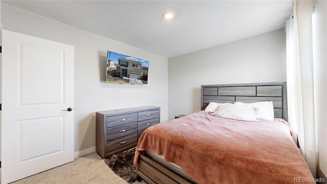carpeted bedroom with baseboards
