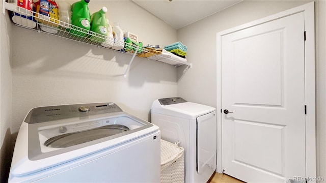 laundry room featuring washing machine and dryer