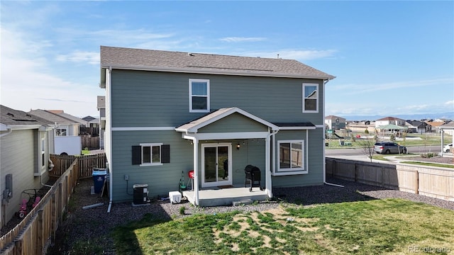back of house with a residential view and cooling unit