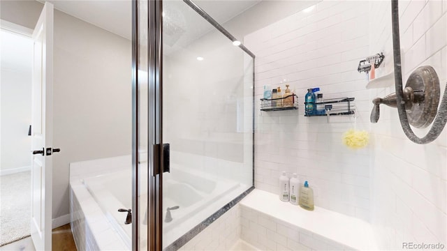 17947 E 95th Ave, Commerce City, CO 80022 - bathroom with a tile shower and a relaxing tiled tub
