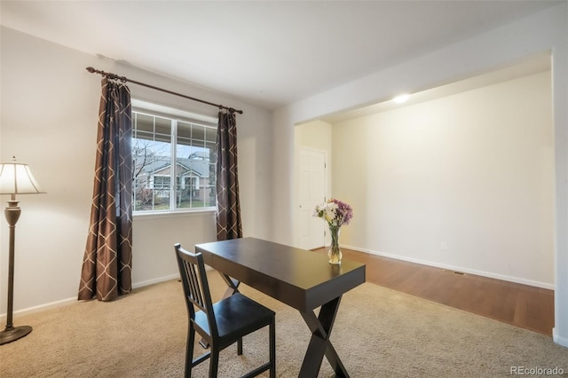 carpeted office with baseboards