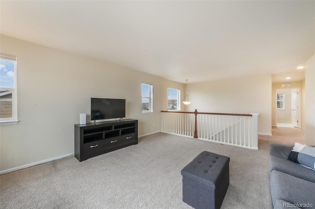 living area with carpet floors and baseboards