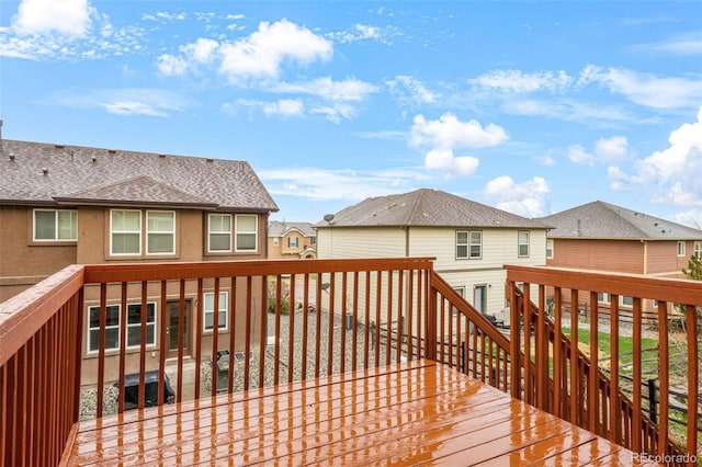 wooden terrace with a residential view