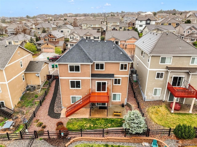 rear view of house with a residential view, a fenced backyard, stairway, a patio area, and cooling unit