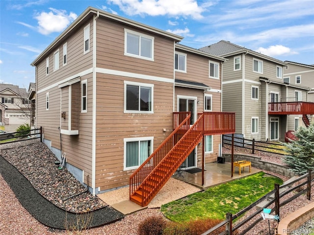 back of property featuring a patio area, stairway, and a fenced backyard