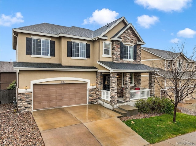 craftsman-style house featuring stone siding, covered porch, stucco siding, and a garage