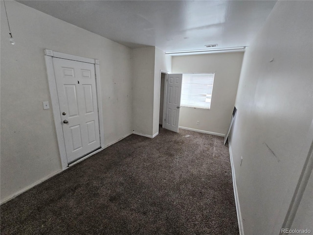 1717 Oswego St, Aurora, CO 80010 - carpeted spare room featuring baseboards