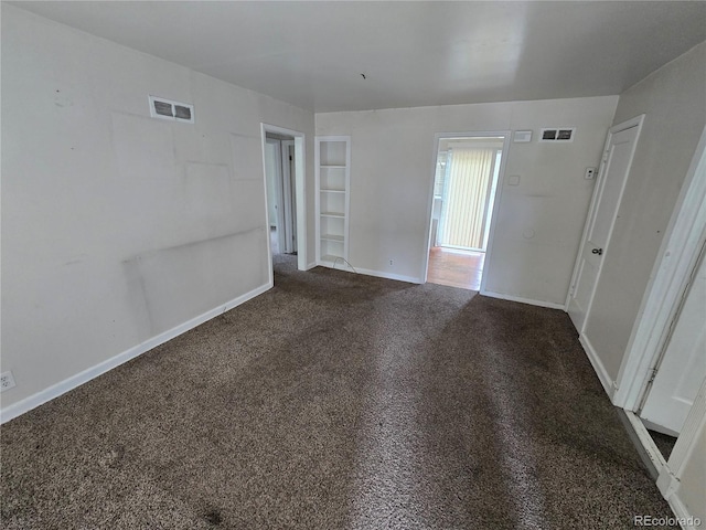 1717 Oswego St, Aurora, CO 80010 - unfurnished room with dark carpet, baseboards, and built in features