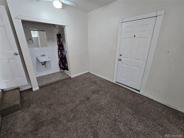 1717 Oswego St, Aurora, CO 80010 - unfurnished bedroom featuring carpet floors, baseboards, and a sink