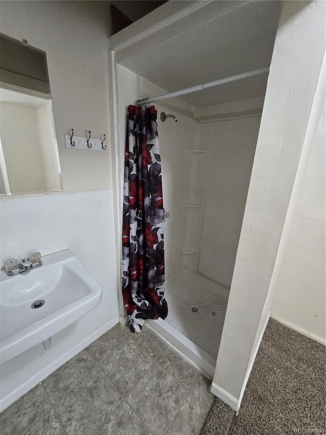 1717 Oswego St, Aurora, CO 80010 - bathroom with a shower stall and baseboards