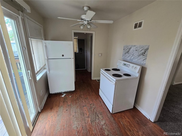 1717 Oswego St, Aurora, CO 80010 - kitchen with white appliances, dark wood finished floors, and plenty of natural light
