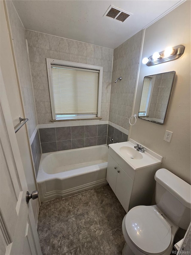 1717 Oswego St, Aurora, CO 80010 - bathroom featuring toilet, vanity, and shower / bathtub combination